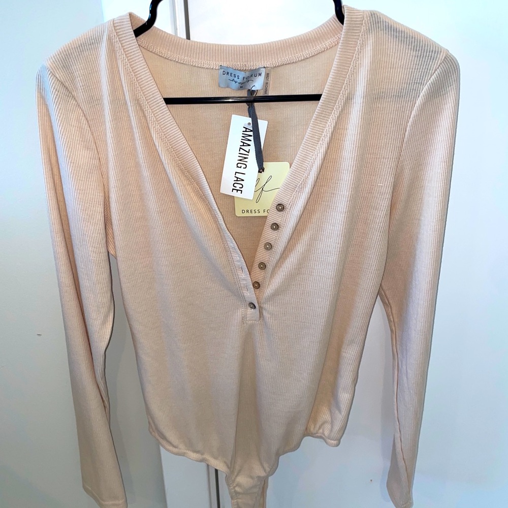 Long sleeved beige bodysuit